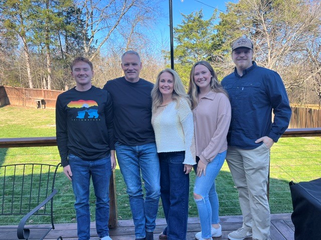 Mike Van Metre with his wife, Michelle, and their three grown children on the family's back deck
